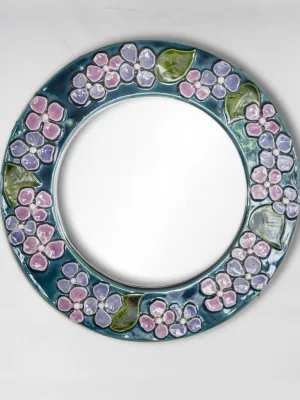 Round mid-century modern mirror w/ blue & purple flowers - Mithe Espelt (1924-2021) - 13"