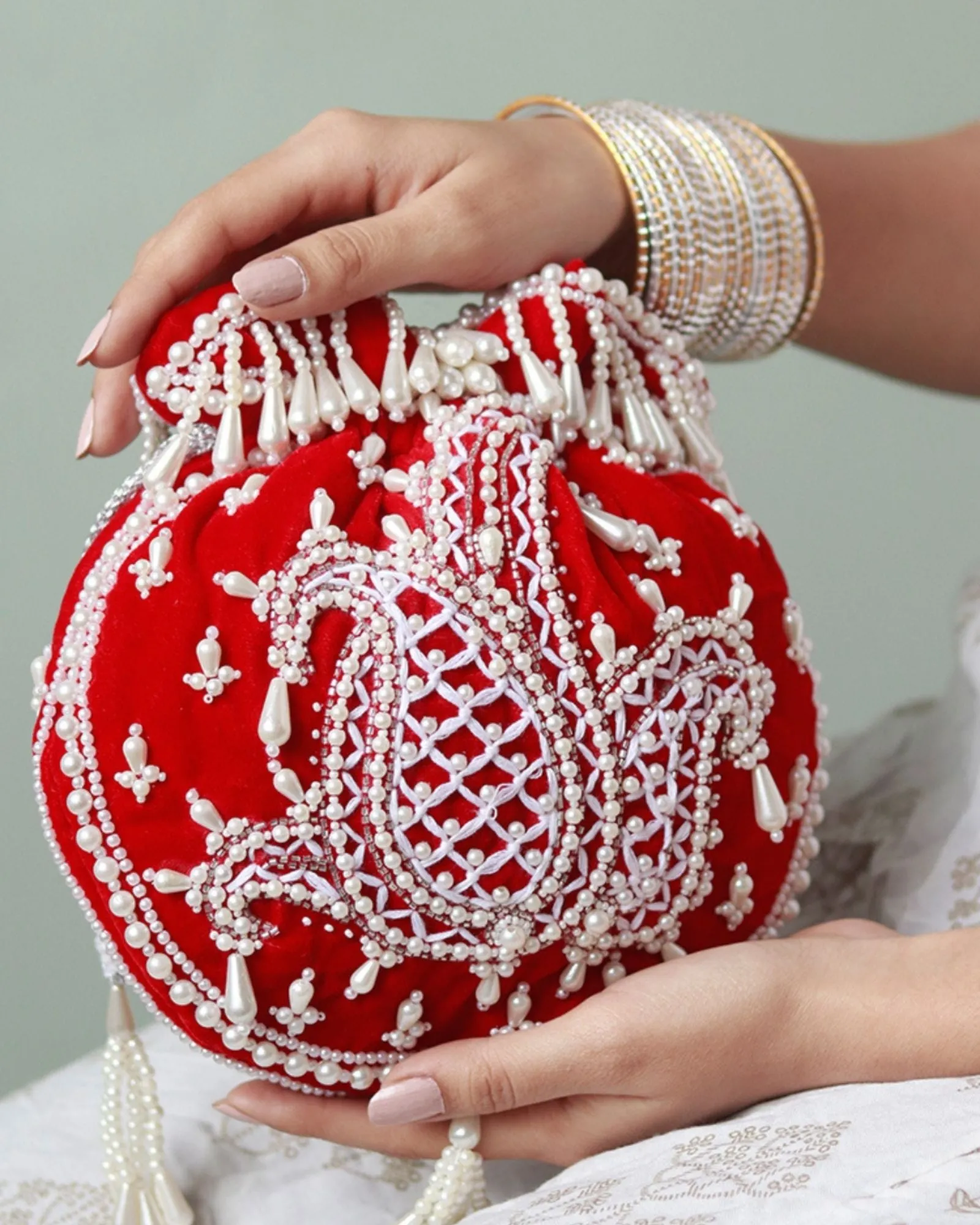 Sukoon Hand Embroidered Potli with Pearl Handle